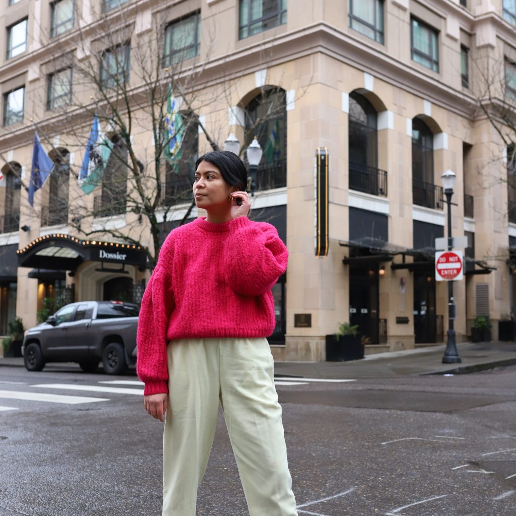 how to bright pink puff sleeve sweater with yellow pants and white sneakers in winter